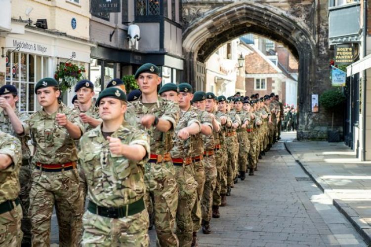 Personnel parade through Salisbury on Armed Forces Day 