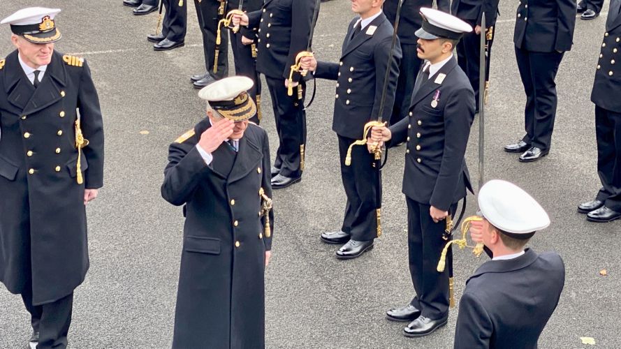 Prince Charles saluting newly commissioned Royal Navy Officers passing out at Britannia Royal Naval College 161221 CREDIT BFBS.jpg