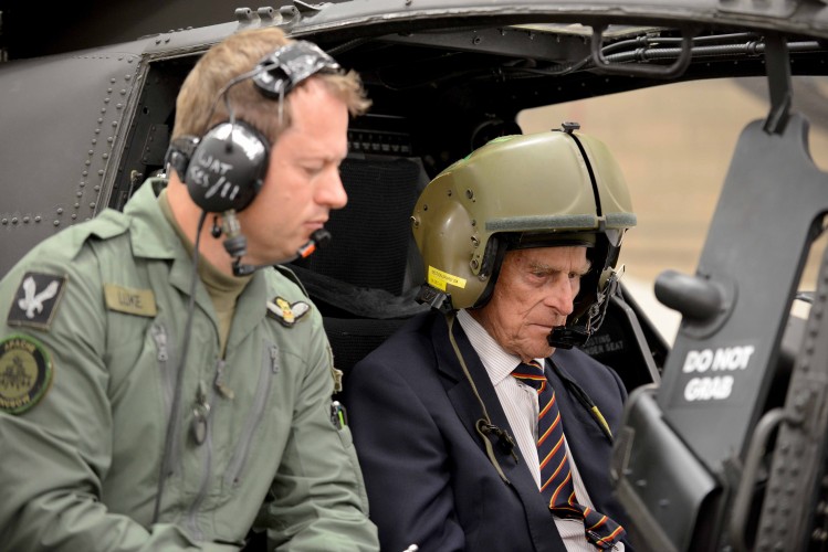 Prince Philip takes the controls in the cockpit of an Apache Attack helicopter, October 2014 (Picture: Crown Copyright).