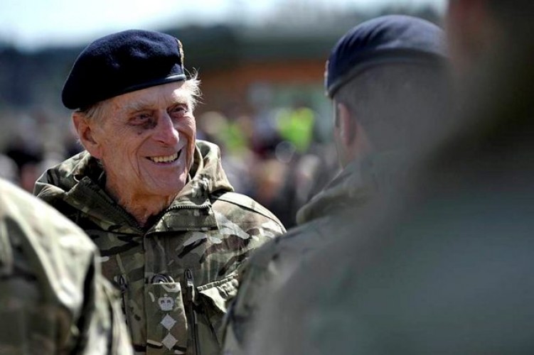 Prince Philip chats with soldiers from 1 Close Support Battalion, Royal Electrical and Mechanical Engineers  at Munster Barracks, Catterick, after returning from Operation Herrick in Afghanistan, May 2013.