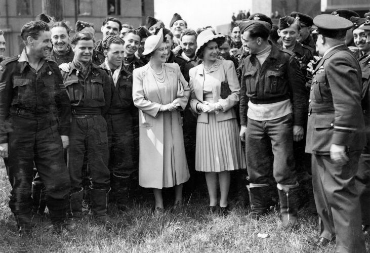 Queen Elizabeth and Princess Elizabeth standing with a group of RAF Bomber Command crews from Nos 15 and 622 Squadrons