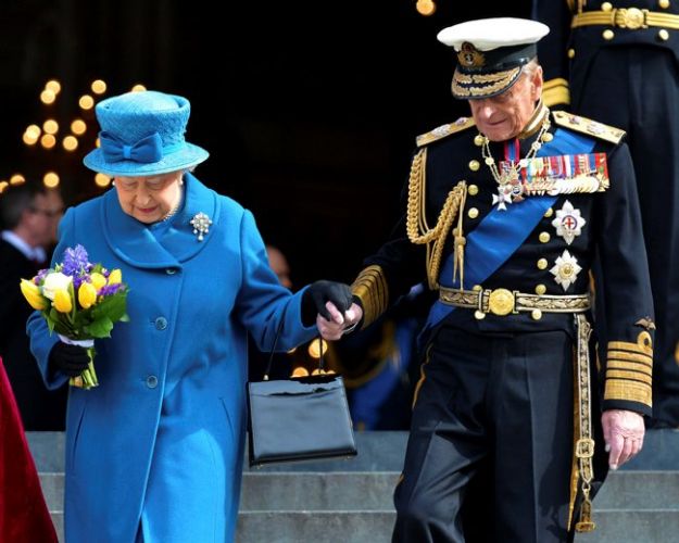 Queen Elizabeth II and Philip hold hands while leaving St Paul's Cathedral, March 2015 (Picture: MOD). Queen Elizabeth II and Philip hold hands while leaving St Paul's Cathedral, March 2015 (Picture: MOD).