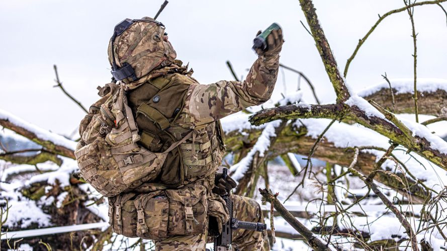 Queens Royal Hussars (QRH) battlegroup soldier throws a smoke grenade during a live fire serial 20012023 CREDIT MOD Crown Copyright.jpg