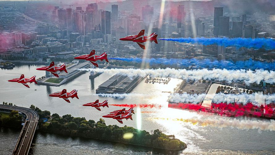 Red Arrows with smoke on as they flypast past Montreal in Canada (Picture: MOD)