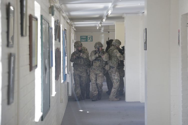 Personnel look for an 'enemy' target.