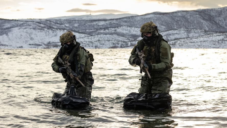 Expert teams from 30 Commando Information Exploitation Group swam ashore and used inflatable raiding boats (Picture: MOD).