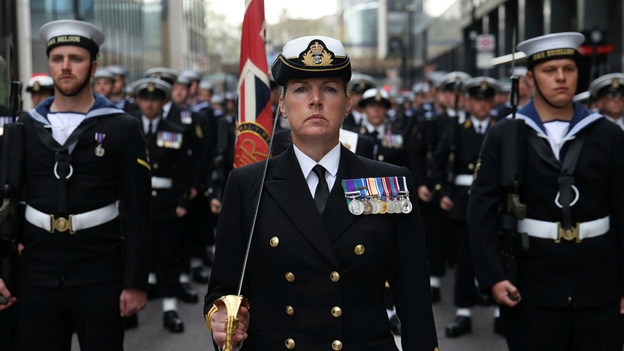 Royal Navy contingent march across Westminster Bridge.