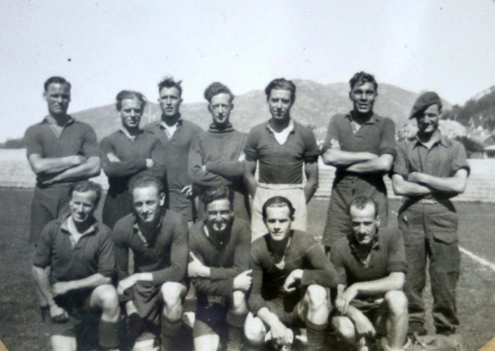 Titled 'SAS Wanderers' 11 servicemen and coach in football kit in Norway