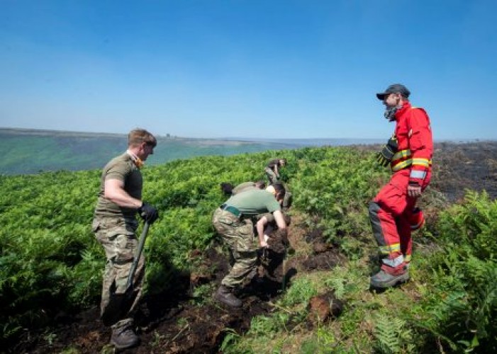 Army battle a wildfire on Saddleworth Moor