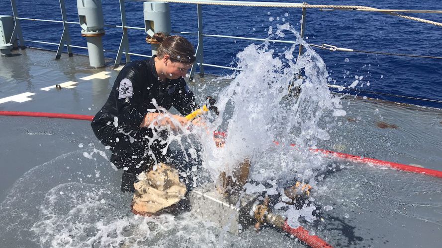 Sailor on board HMS Scott training to deal with fires and floods