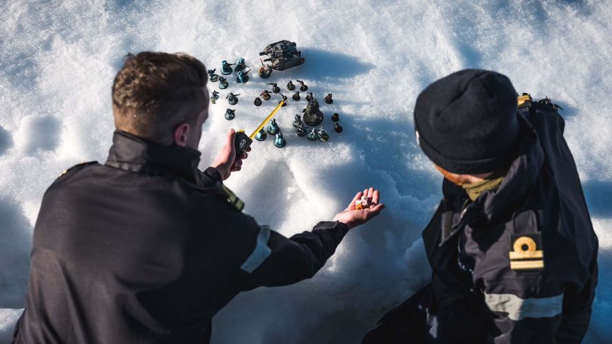Sailors from HMS Protector playing warhammer, Dice on the Ice with Lts Jonny Talbot left and Max Friswell 11022023 CREDIT Royal Navy.jpg