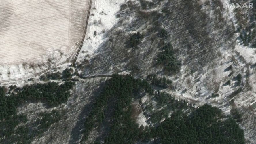Satellite image appearing to show Russian convoy moving into forests outside Kyiv (Picture: Maxar Technologies via REUTERS).