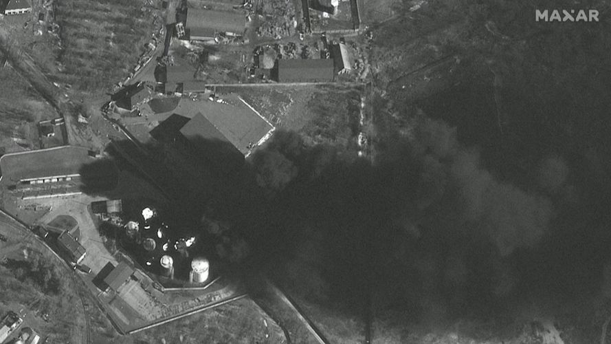 Smoke rising in a satellite image appearing to show Russian convoy moving from its position just outside Kyiv (Picture: Maxar Technologies via REUTERS).