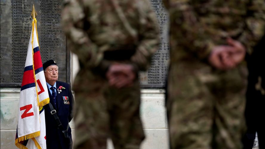 Standard bearer at the WWI memorial, Guildhall Square, in Portsmouth, as people gather to remember the war dead on Armistice Day 111121 CREDIT PA, ALAMY.jpg