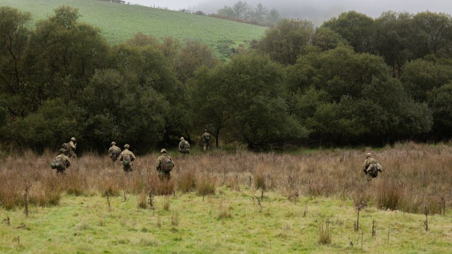 Soldiers from The Australian Defence Force make their way through the terrain to the next objective (Picture: MOD) The Australian Defence Force Exercise Cambrian Patrol 2026 Breacon Beacons 051026 CREDIT MOD