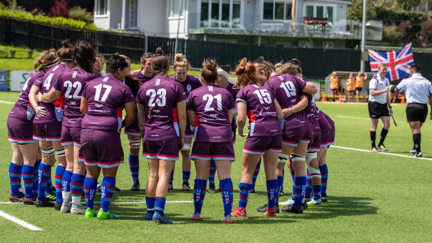 The UKAF players show team unity on the pitch with the British flag flying proudly in the background Credit Alligin Photography