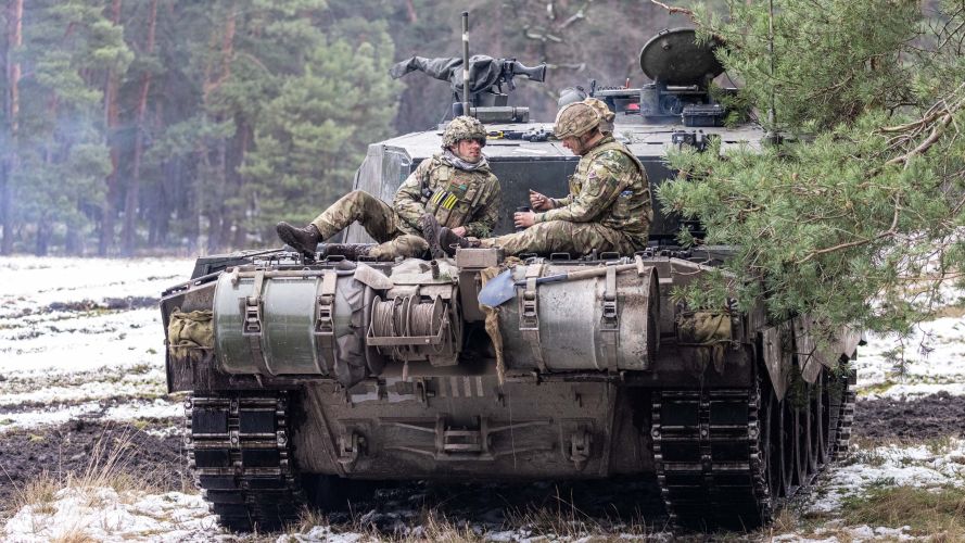 Two Soldiers taking a pause on top of the back of a Challenger 2 main battle tank 24012023 CREDIT MOD Crown Copyright.jpg