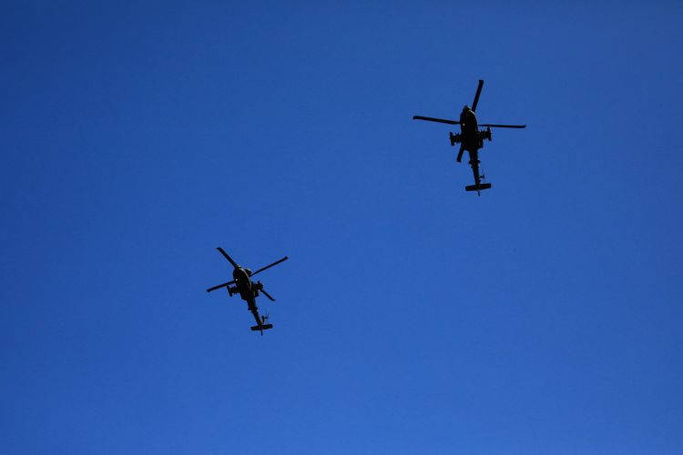 Two helicopters pass overhead as junior soldiers graduate from the AFC Harrogate.