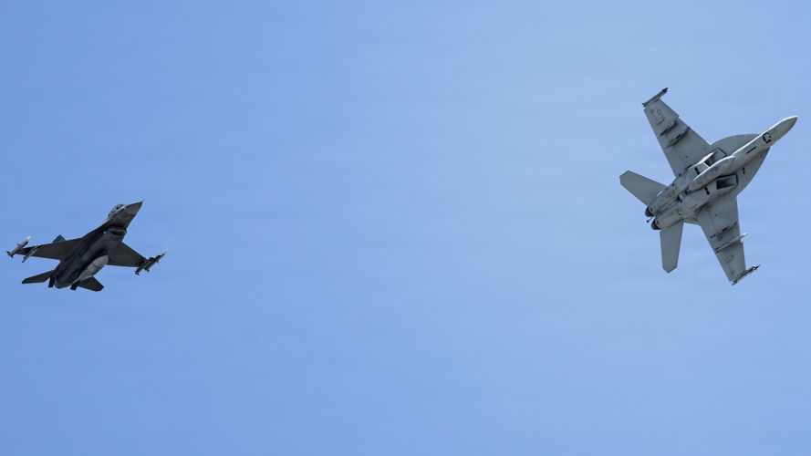 The exercise is a chance for pilots to simulate combat scenarios (Picture: US Department of Defence) US Air Force F 16C Fighting Falcon and US Navy FA 18E Super Hornet assigned Exercise Checkered Flag CREDIT US DEPT DEFENSE