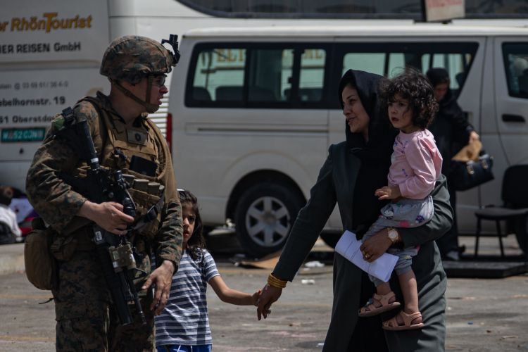 US Marine escorts evacuees at Kabul airport
