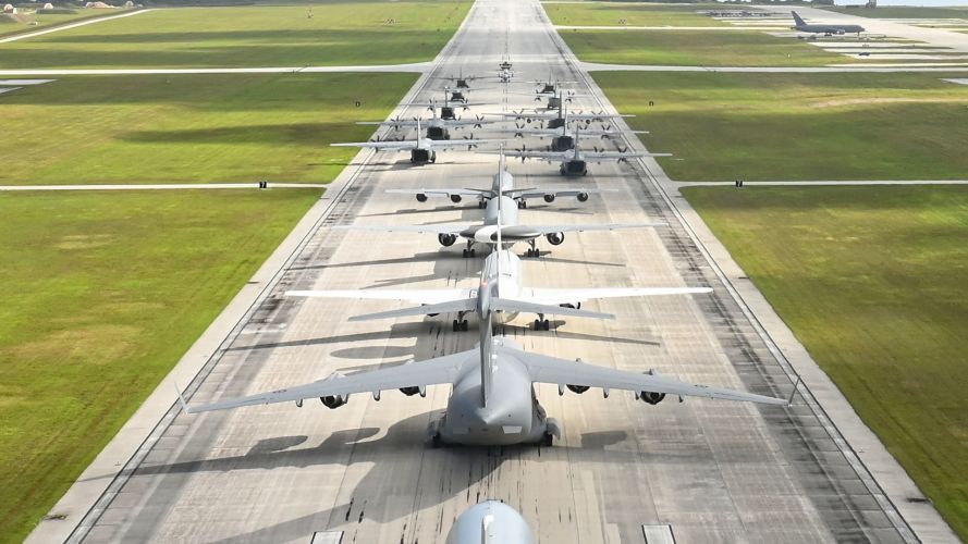 US, Australian and Japanese aircraft performing an 'Elephant Walk' in Guam, from the runway