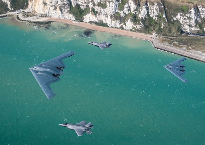 USAF B-2s fly over the English Channel with F-35Bs (Picture: MOD).