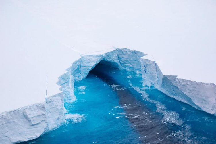 Vertical sides of A68a iceberg uncovers tunnels under the iceberg, as well as deep fissures extending downwards.