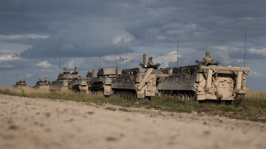 Warrior vehicles form up before getting debriefed on the days training Exercise Iron Cyclone 25072023 CREDIT MOD.jpg