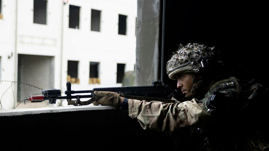 A soldier from C Company, the 1st Battalion Scots Guards watching over their Arcs of fire during the Defensive phase on Exercise IMJIN WARRIOR (Picture: MOD).