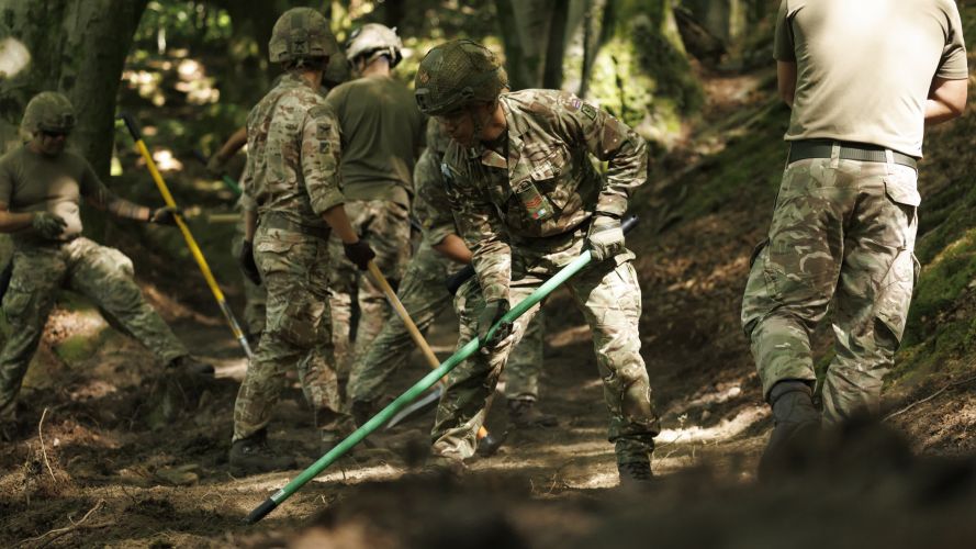 Soldiers from 10 Queen's Own Gurkha Logistic Regiment (10 QOGLR) digging out fire breaks within the woodblocks in Wales by hand (Picture: MOD) Army steps in to help with South Wales wildfires pic MOD