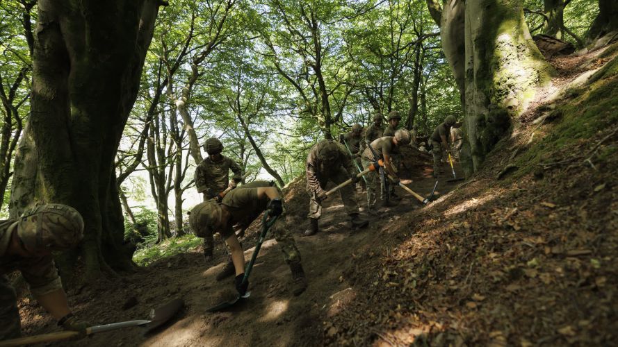 Soldiers from 10 Queen's Own Gurkha Logistic Regiment (10 QOGLR) digging out fire breaks within the woodblocks in Wales by hand (Picture: MOD) Army steps in to help with South Wales wildfires pic MOD