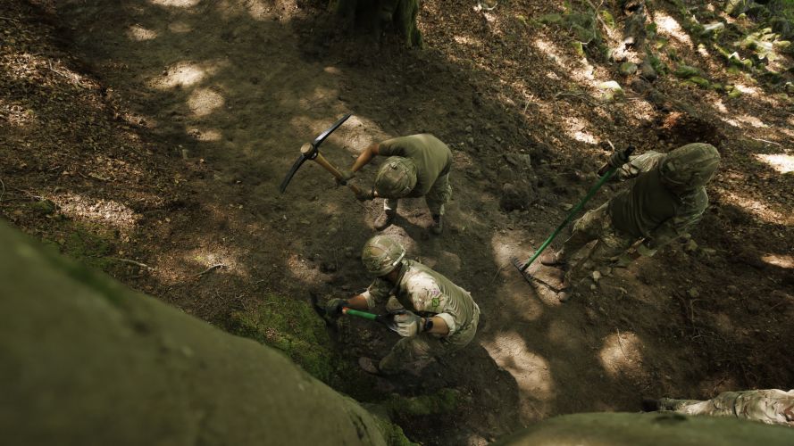 Soldiers from 10 Queen's Own Gurkha Logistic Regiment (10 QOGLR) digging out fire breaks within the woodblocks in Wales by hand (Picture: MOD) Army steps in to help with South Wales wildfires pic MOD