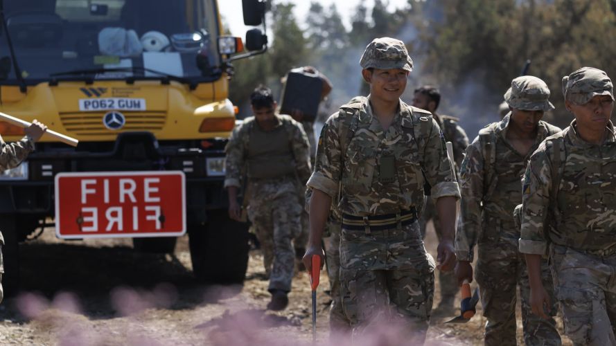 Soldiers from 10 Queen's Own Gurkha Logistic Regiment (10 QOGLR) after digging out fire breaks and making way for Cumbria Fire Service and Rescue to tackle fires in Wales (Picture: MOD) Army steps in to help with South Wales wildfires pic MOD