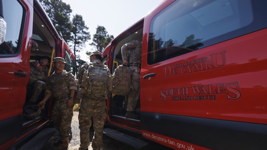 Soldiers from 10 Queen's Own Gurkha Logistic Regiment (10 QOGLR) getting on to buses provided by South Wales Fire and Rescue (Picture: MOD) Army steps in to help with South Wales wildfires pic MOD