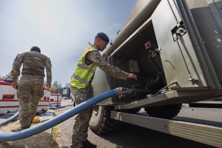 Soldiers from 10 QOGLR help by filling up water bowsers and mobile water reservoirs with water (Picture: MOD) Soldiers from 10 Queen's Own Gurkha Logistic Regiment (10 QOGLR) assisting with filling up water bowsers and Mobile water reservoirs with water from local Welsh farmers and the Wales Fire Service using Military Close Support Tankers Pic MOD