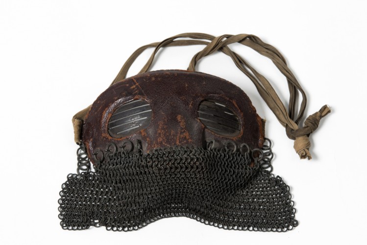 A British tank visor. They were worn for protection against the chips of hot metal flying in the interior of the tank as a result of hits on the outside.
