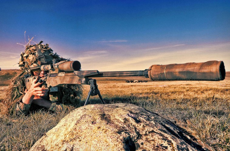 A sniper watches over a vast area in BATUS, looking for targets and providing cover and support to the main battlegroup.