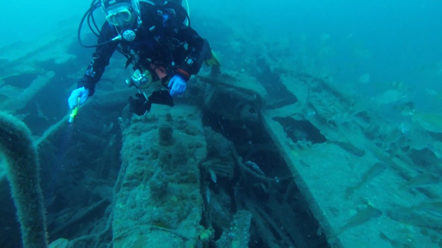 Diver looking at the engine of the 'Arfon' - 
Copyright Swanage Boat Charters Ltd