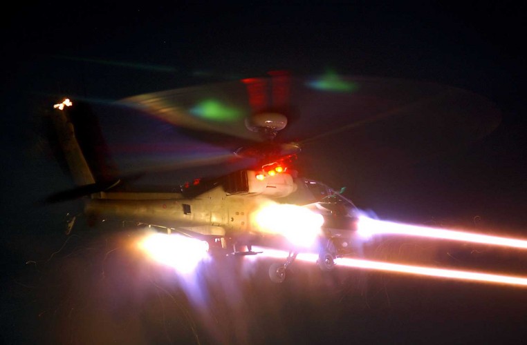 A British Army WAH-64 'Apache' attack helicopter fires a salvo of CRV7 (Practise) rockets at targets down range.

Photo Crown Copyright 2013

