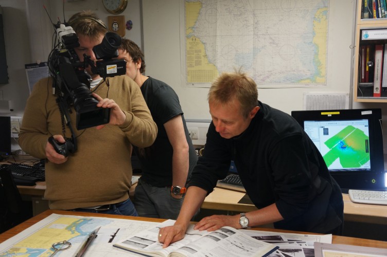 National Museum of the Royal Navy historian Nick Hewitt explaining the scans to an onboard BBC documentary team.