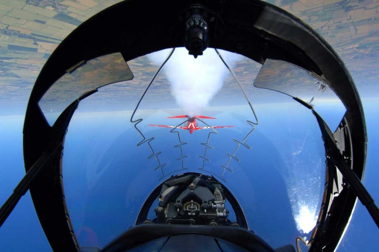 Pic Two

Red 10 & 11 of the RAF Aerobatic Team, The Red Arrows, practicing their manoeuvres over RAF Scampton, Lincoln. This picture shows the pilots view.

Photo Crown Copyright 2006