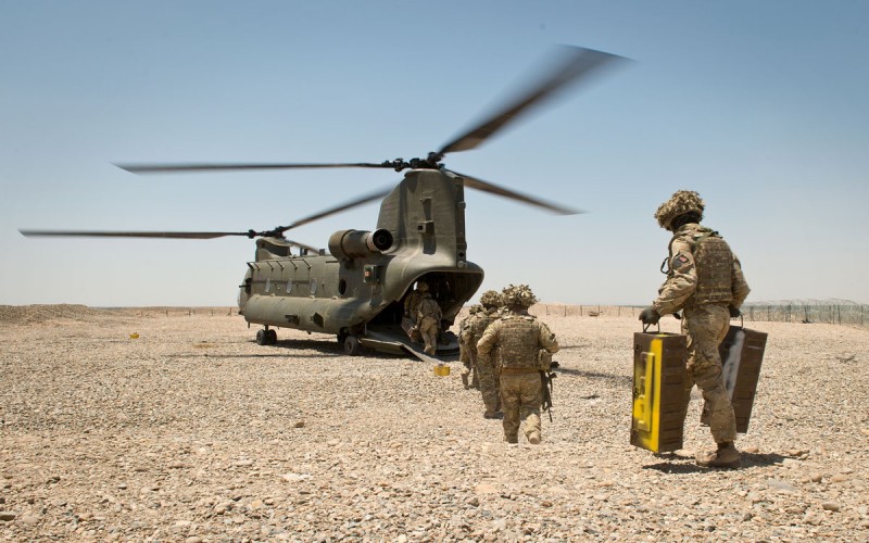 Soldiers of 4 SCOTS Bn board a British CH-47 helicopter on 10 May 2014, the final morning of the British occupation of PB Sterga 2, as they prepare to leave the base for the final time