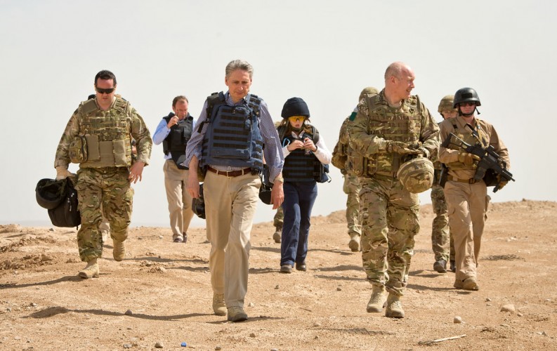 Phillip Hammond MP, Secretary of State for Defence, walks the short distance from PB Sterga 2 helipad to the base itself