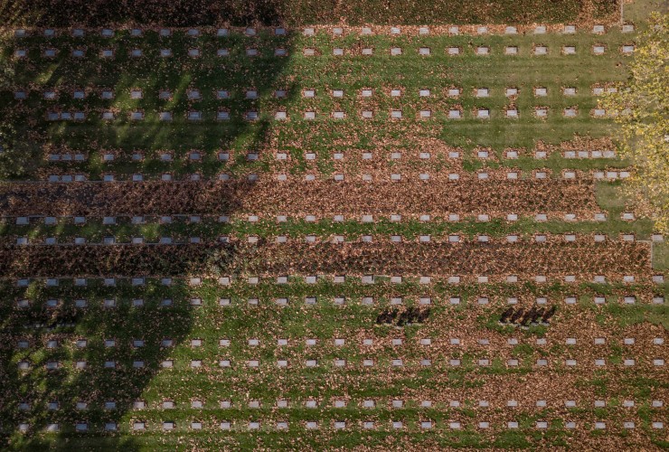 The images from 125ft up show the scale - with ranks of white grave markers on the Belgian countryside (Pictures: SWNS).