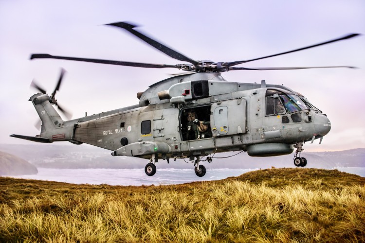 Pictured are 820 Naval Air Squadron making the most of the Cornish Landscape to hone their Fly Navy skills.  A local photographer, Greg Caygill, caught the Merlin Mk2 helicopter in the sand dunes near Perranporth beach. 