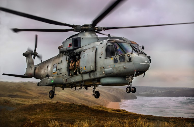 Pictured are 820 Naval Air Squadron making the most of the Cornish Landscape to hone their Fly Navy skills.  A local photographer, Greg Caygill, caught the Merlin Mk2 helicopter in the sand dunes near Perranporth beach. 