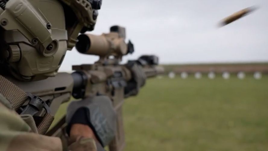 An empty case is ejected as a marine opens fire with the KS-1