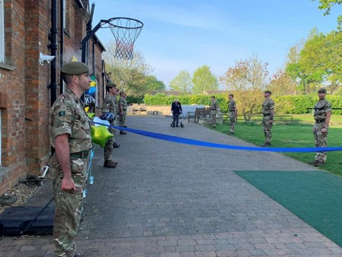 Captain Sir Tom Moore finishes his charity walk in April 2020, with a guard of honour from soldiers (Picture: MOD).