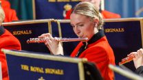 Flutist Watson from The Royal Signals performs during a Christmas concert with the Northern Band in Darlington