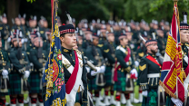 Regimental colours on parade as soldiers from SCOTS march from the Palace of Holyroodhouse